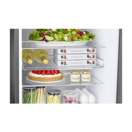 Samsung RB38C7B5D39/EF refrigerator with freezer below, open refrigerator, glass shelves with wine bottles, chocolate, dessert, jars